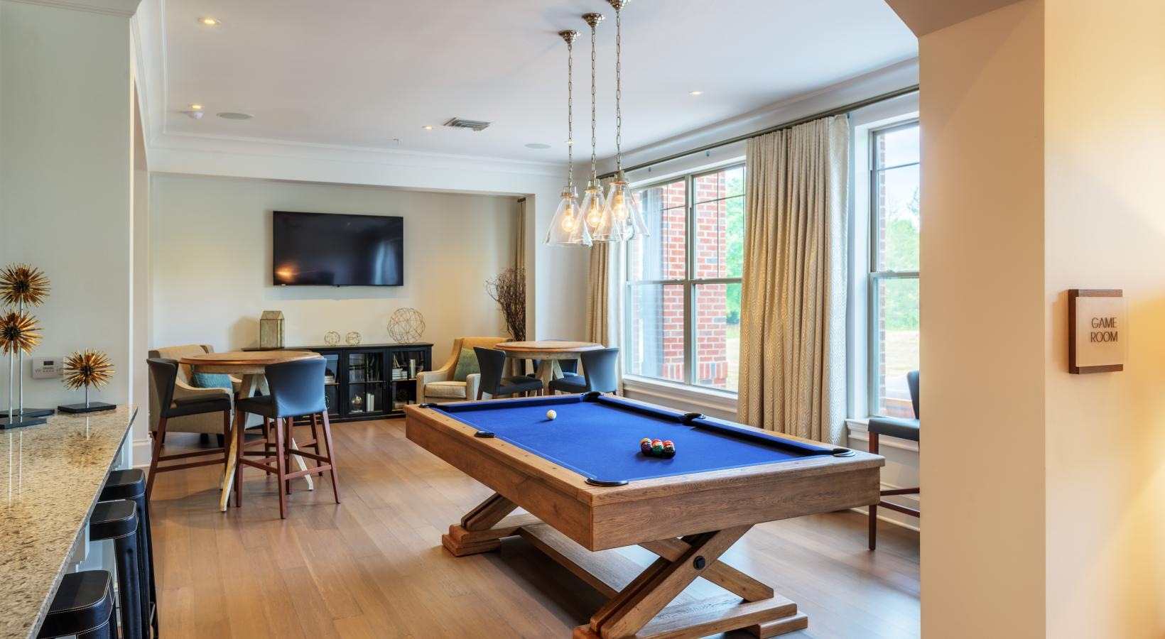 Everything within reach a pool table in a room