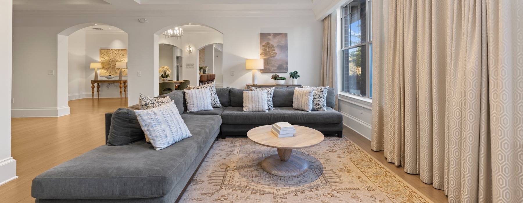 a sofa in a spacious room with ample light