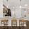 stools at kitchen counter with pendant lighting