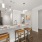 place settings on kitchen counter with stools