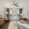 large, bright living room with ceiling fan