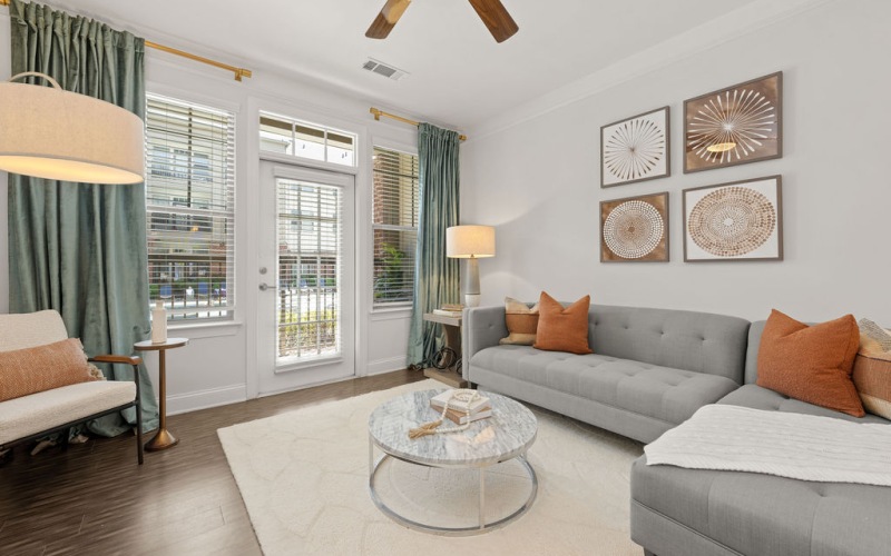 Living room with patio door at Fountains Matthews luxury apartments in Matthews, NC.