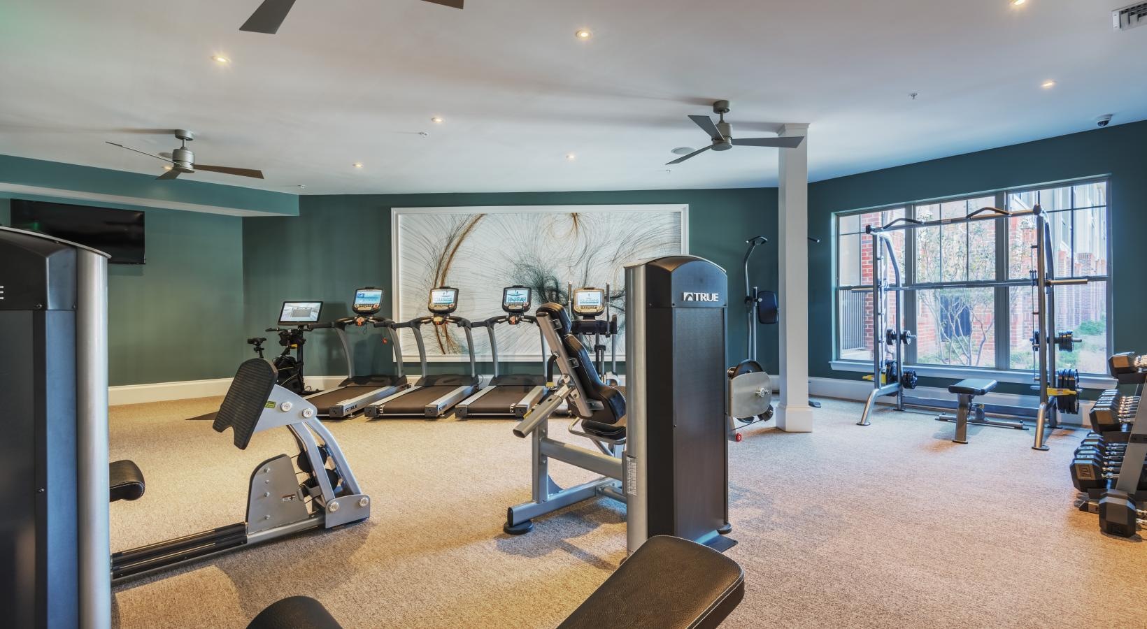 Quick access to state-of-the-art amenities a gym with exercise equipment