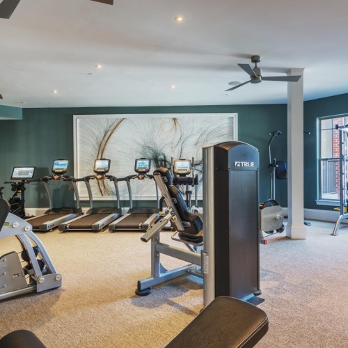 Quick access to state-of-the-art amenities a gym with exercise equipment