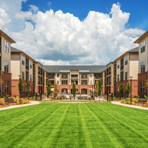 Settle into comfort at Fountains Matthews Apartments a large courtyard between buildings