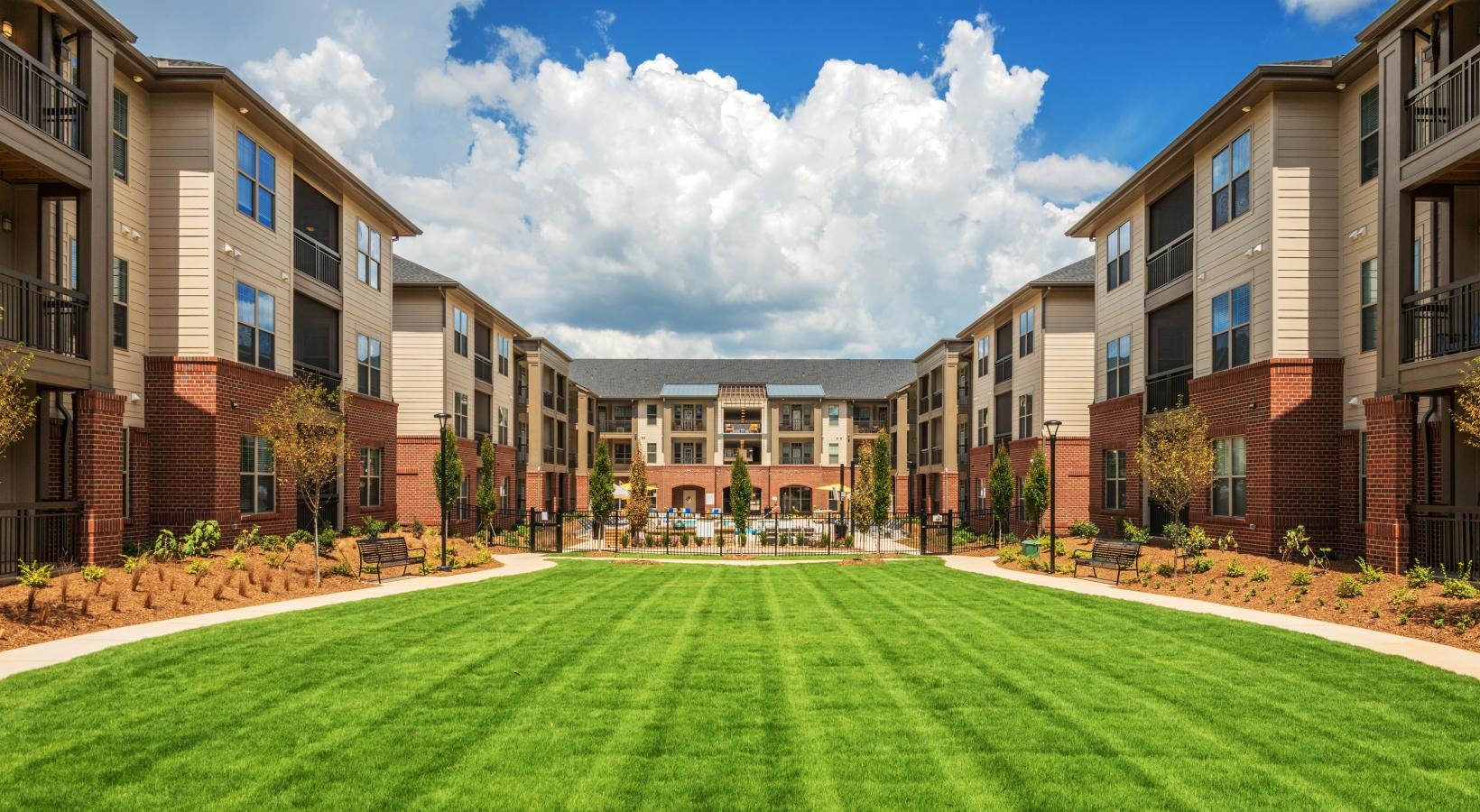 Settle into comfort at Fountains Matthews Apartments a large courtyard between buildings