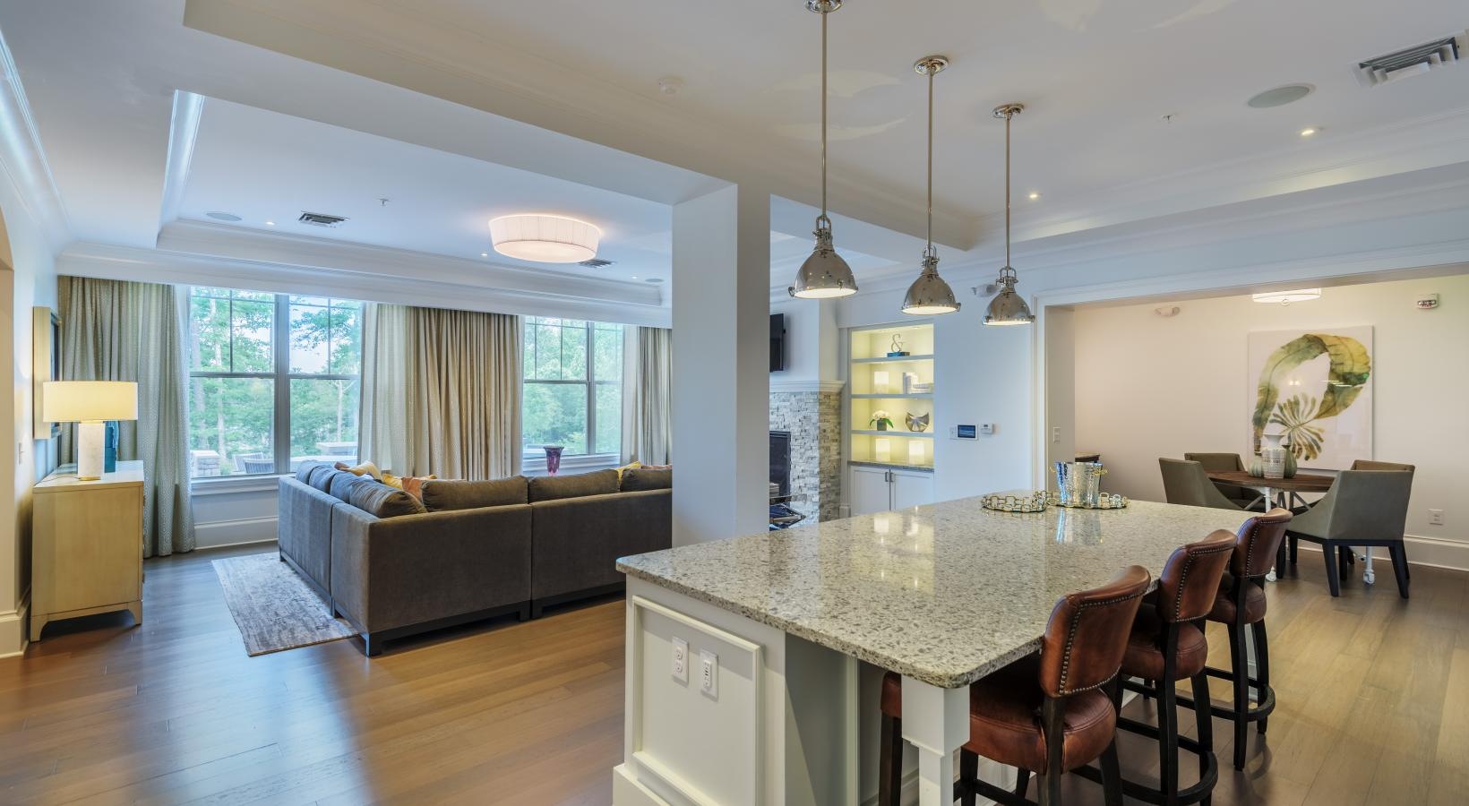 Find your perfect fit at Fountains Matthews Apartments a living room with a couch and a table