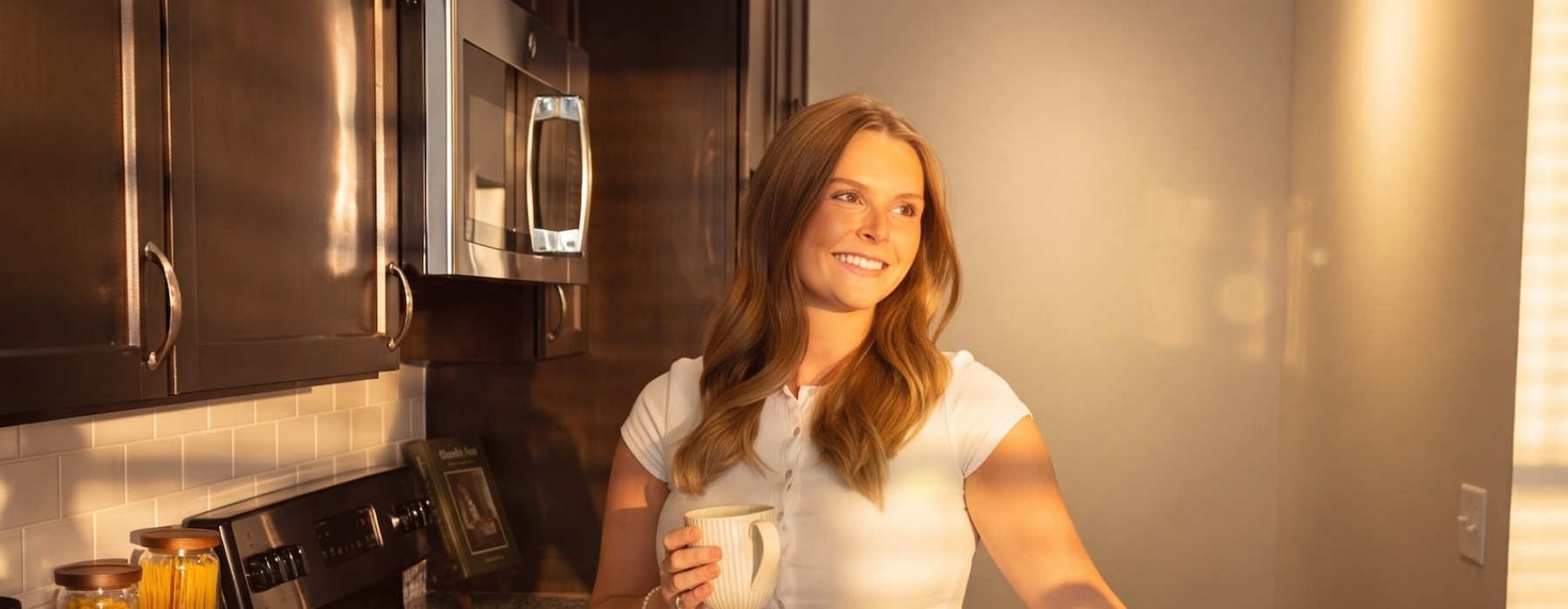 a woman standing in a kitchen