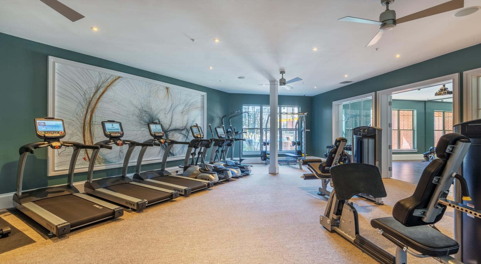 Get your workout on a room with treadmills and a large window